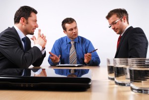 Three businessmen handling negotiations.